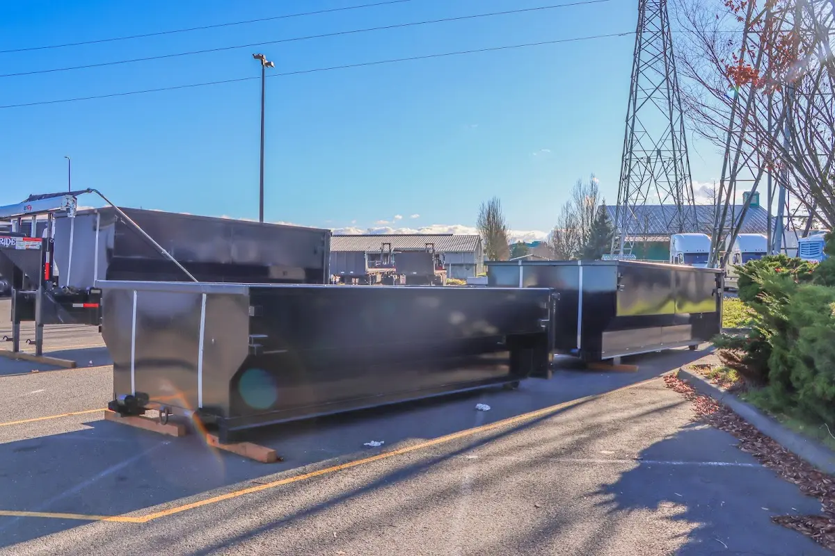 Roll-off dumpster ready for waste disposal at job site for Yard Waste Dumpster Rental in Fulton